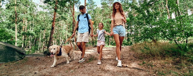Family and their Labrador for article on best dog breeds for families