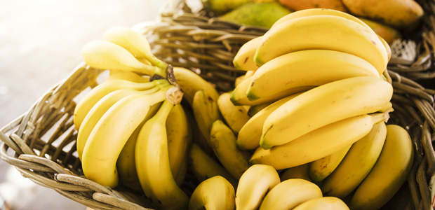 bunch of yellow bananas in a basket
