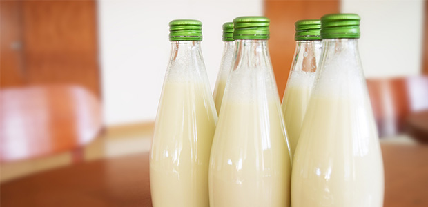 five glass bottles of milk